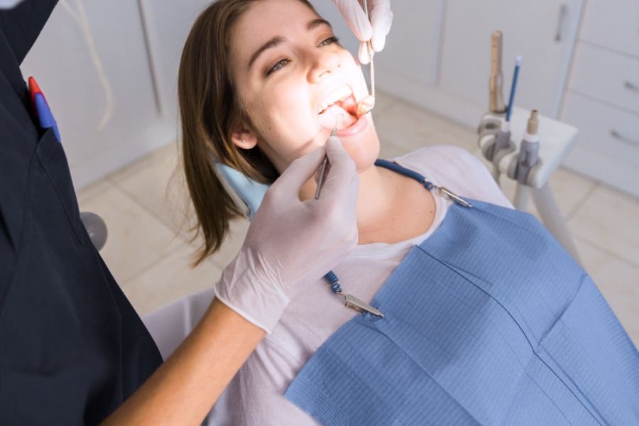 Woman at the dentist in the chair having a dental checkup