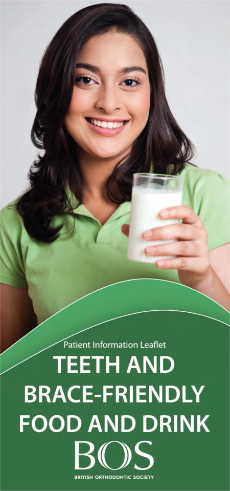GIRL HOLDING A GLASS OF MILK